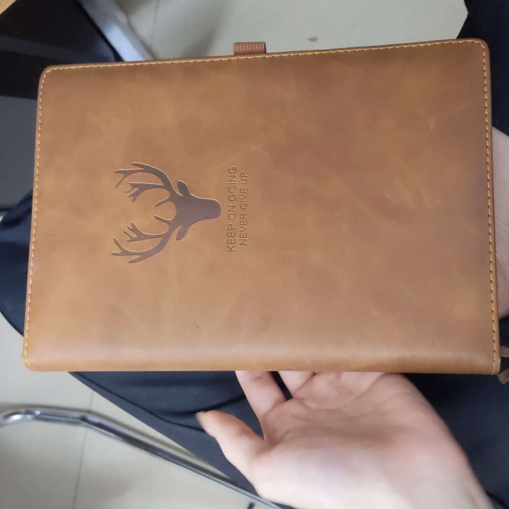 500-page brown leather notebook with deer image